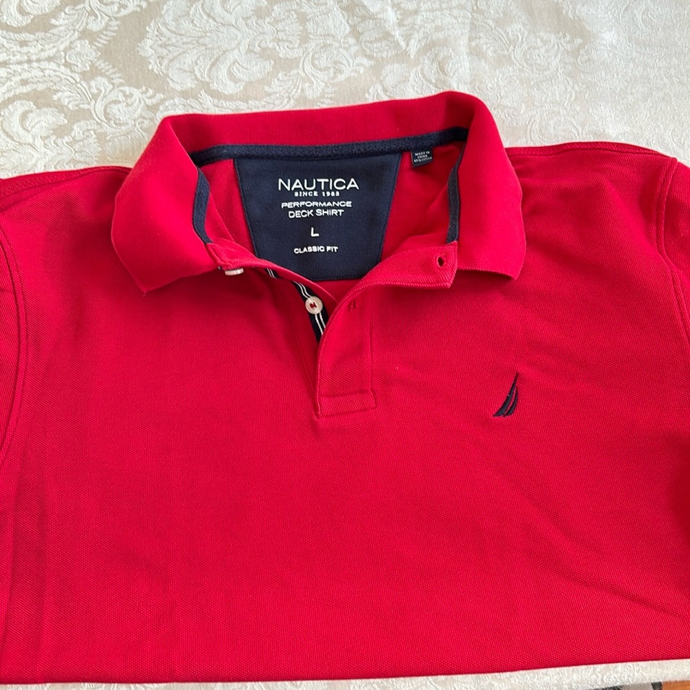 2 Polo shirts from Nautica red is a large and black is an xl. Performance deck